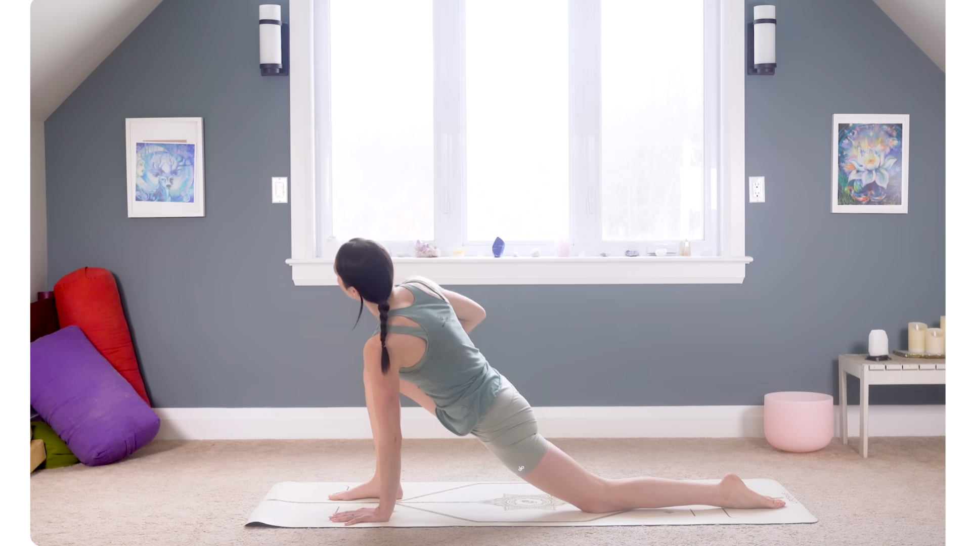 Woman kneeling on a mat in a Low Lunge Twist